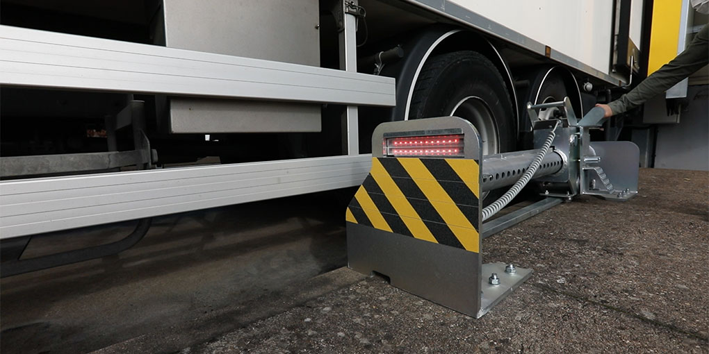 Truck Secured at the Dock by a Manual Wheel Restraint